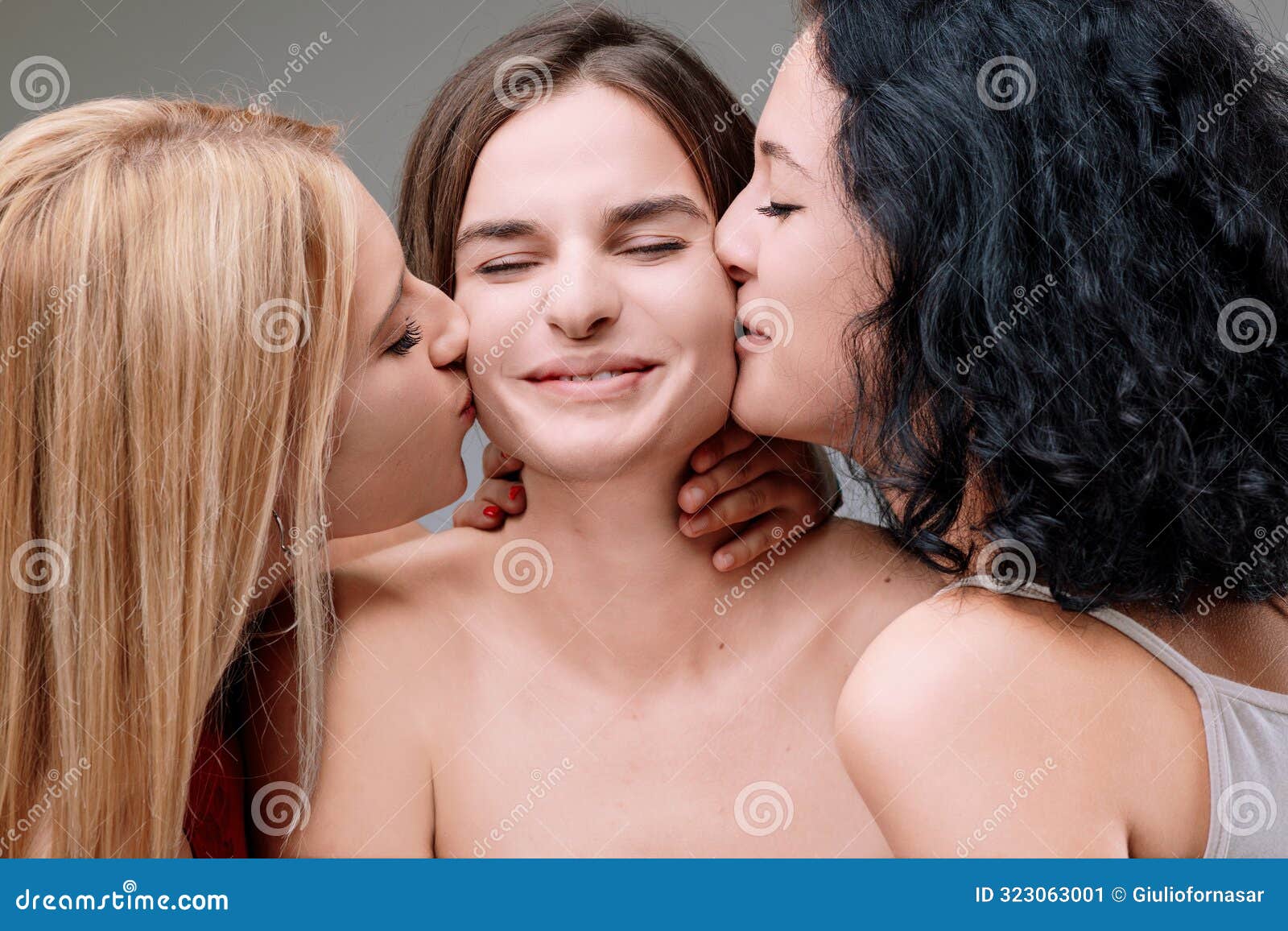 man kissing woman boobs