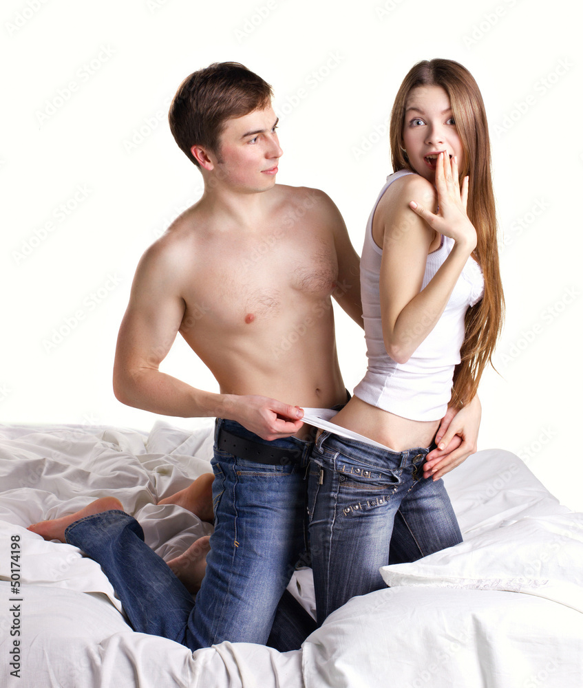 man undressing woman