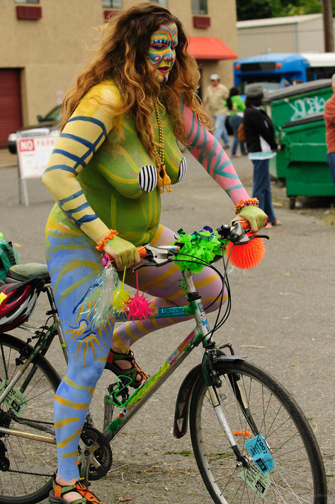 naked woman riding a bike